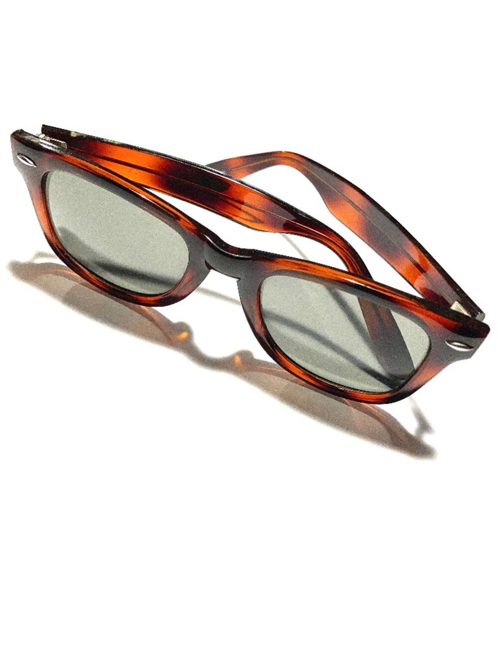Sunglasses with Tortoise Frames and Green Lenses